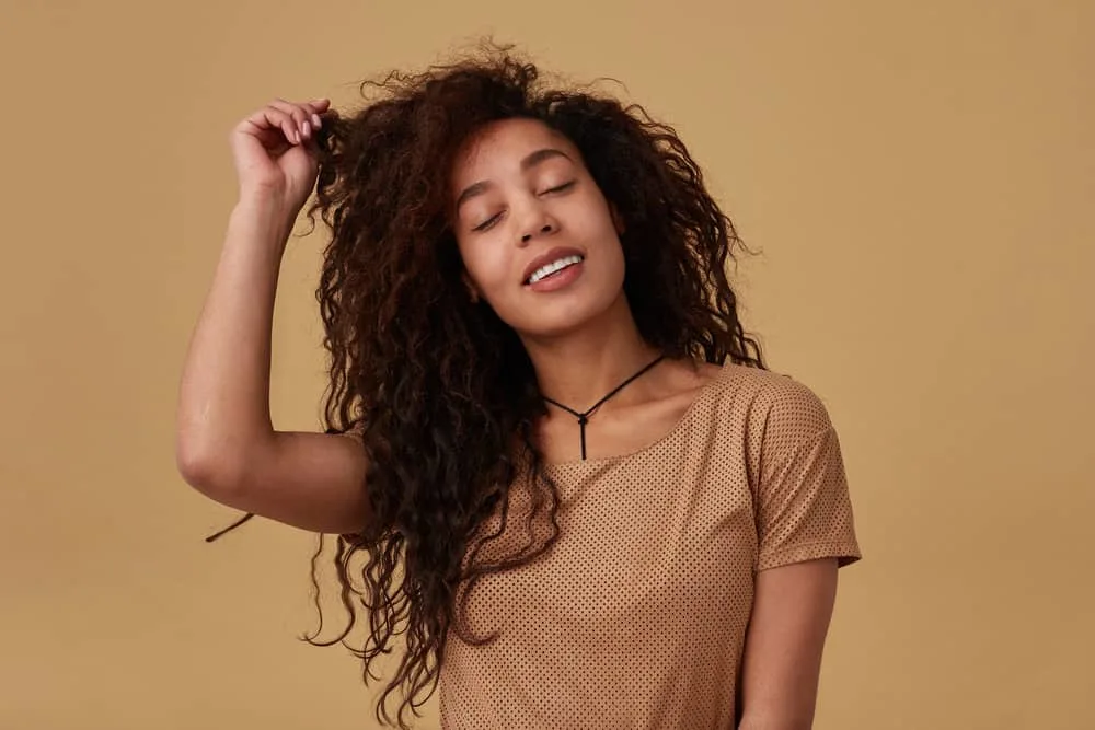 How to Do a 90s Blowout Style at Home on Short or Long Hair 11 Lady in the photograph received a deep conditioning treatment on her dark brown.