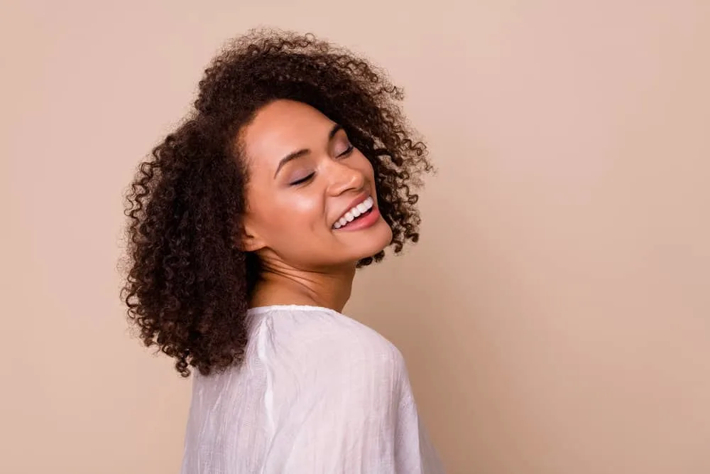 How Coconut Oil Ruined My Hair: The Dangers of Coconut Oil 5 Light-skinned black female with type 3 hair strands that were styled coconut oil alternatives like castor oil.