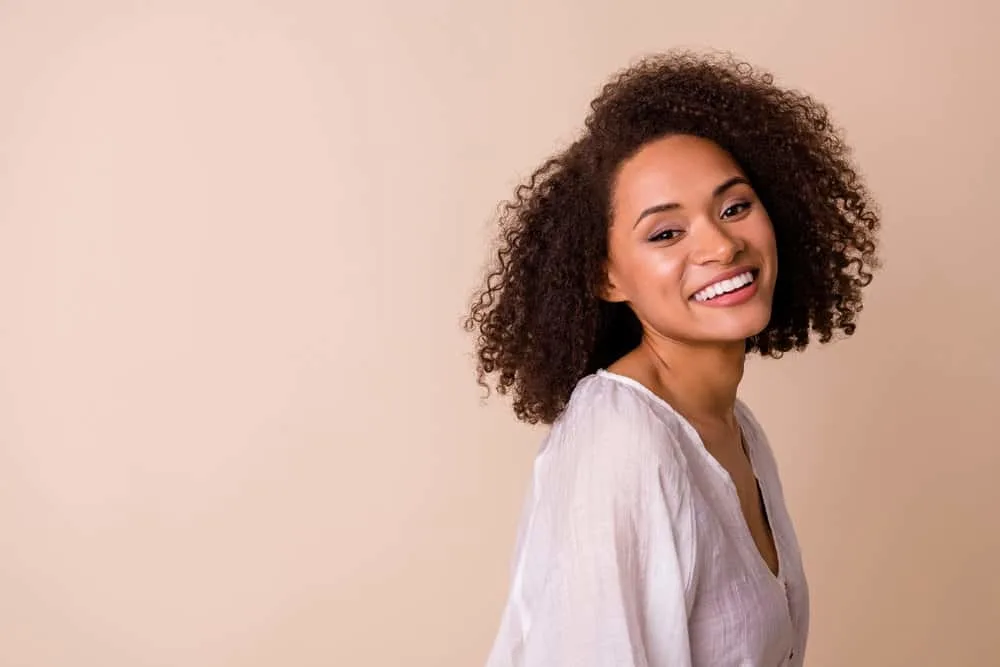 How Coconut Oil Ruined My Hair: The Dangers of Coconut Oil 3 A positive young black female with hair cuticle damage after using coconut oil hair treatments on her 3C curls.