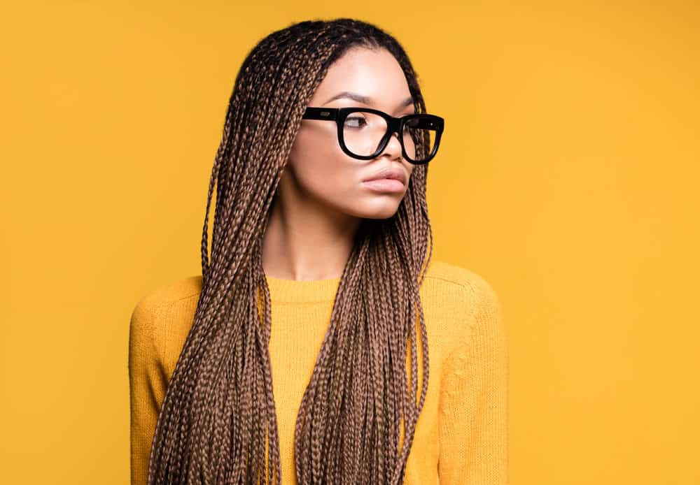 A beautiful African American with a long hair hairstyle suits her wide forehead - a messy look created on short hair.