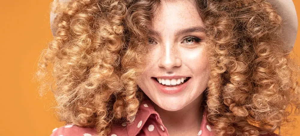 How Long Does Bleached Hair Last and How to Repair Damage 9 A young white lady with hair damage after using hair coloring hair products during a bleaching treatment.