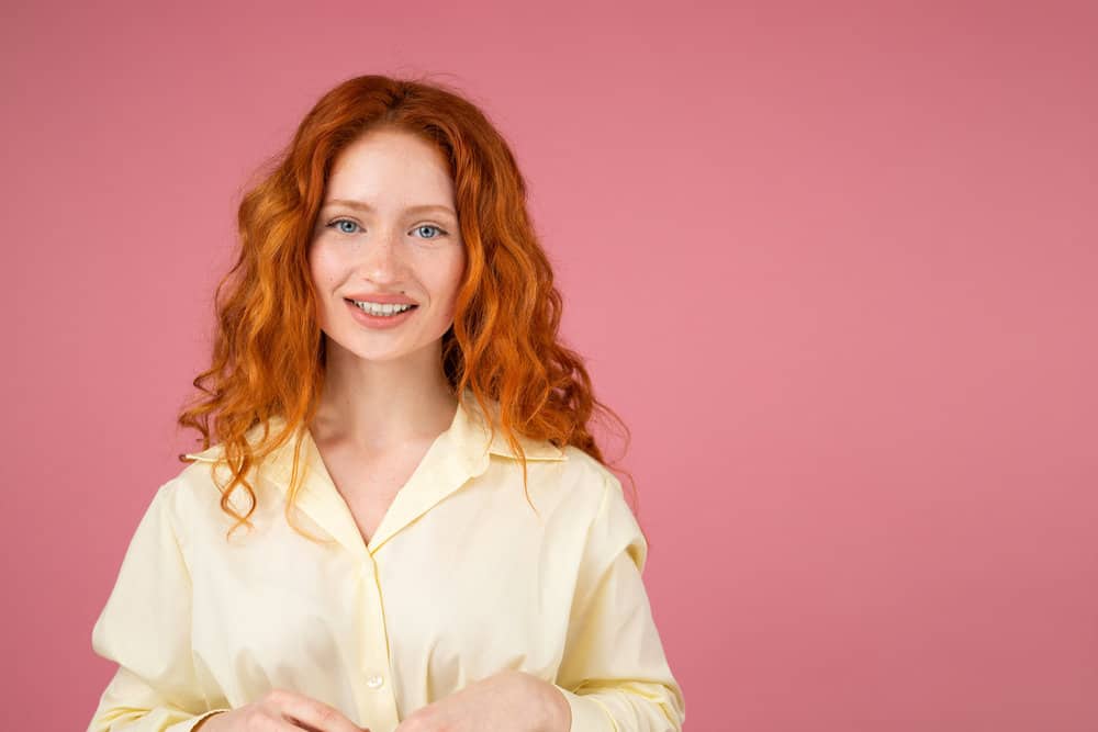 A pretty young girl with thin hair that's slightly wavy was washed with a sulfate-free shampoo and air drying.