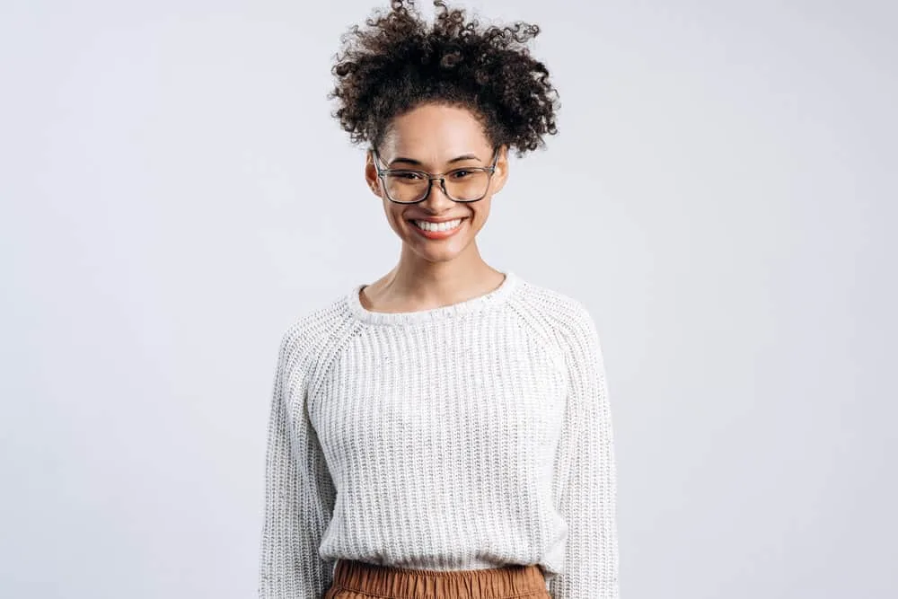Does Maui Moisture Cause Hair Loss? What About Their Shampoo? 2 African American female with damaged hair from harsh chemicals is experiencing hair breakage and frizzy hair.