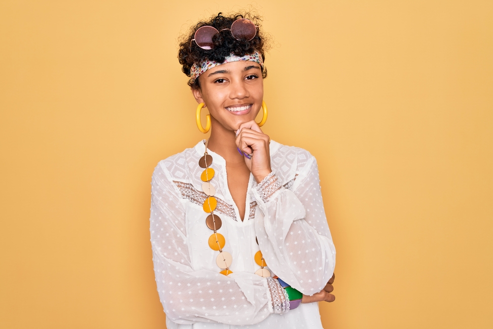 This African-American woman's hair is medium-thick and has been texturized with texture spray to add depth.