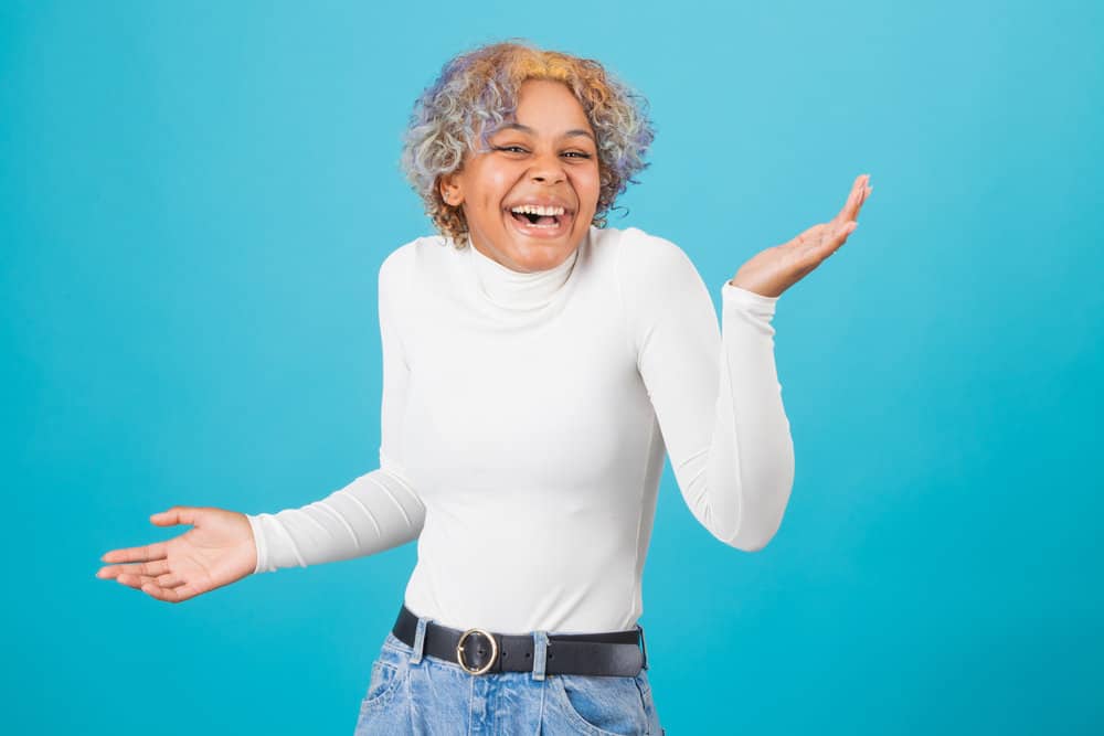 African American female with a blue and orange hair color after dyeing her naturally darker hair with Splat hair dye.