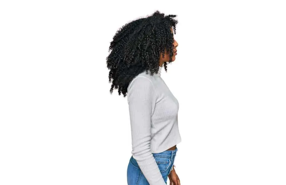 Why Is My Hair Stretchy? Is It Normal? What Does It Mean? 2 An African American lady with recovering bleached hair wants to improve hair elasticity with a deep conditioner.