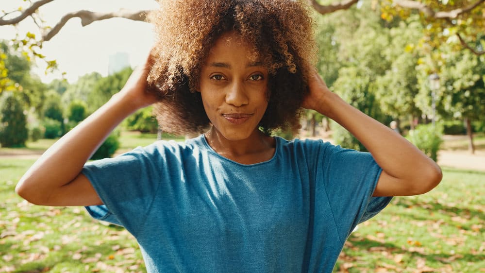 African American females' hair feels rough after constantly wearing straight hair from heat styling tools.