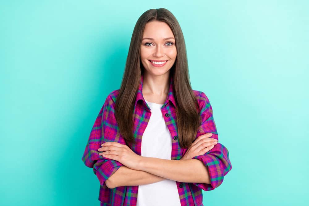 A nice-looking brown-haired Caucasian female with both 1C and 2A wavy hair types on her medium texture strands.