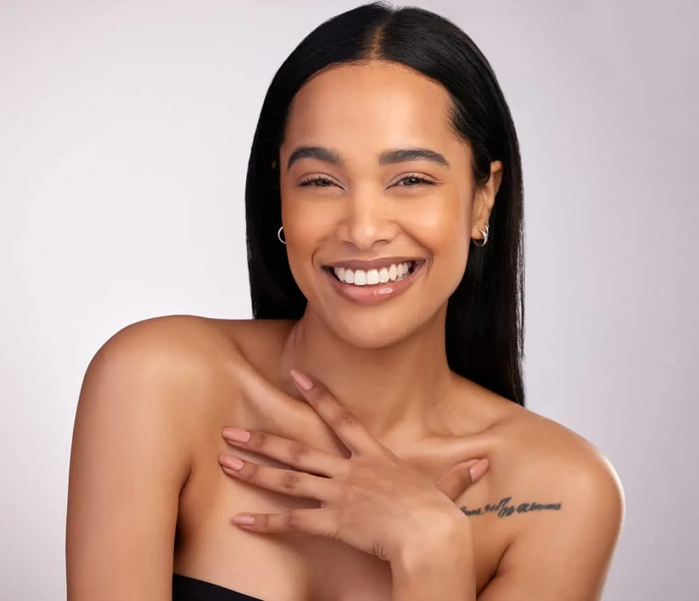 How Much Is a Keratin Treatment at a Salon for Short & Long Hair 1 A black lady with a straight hair texture after getting her frizzy hair straightened with a flat iron and keratin complex.