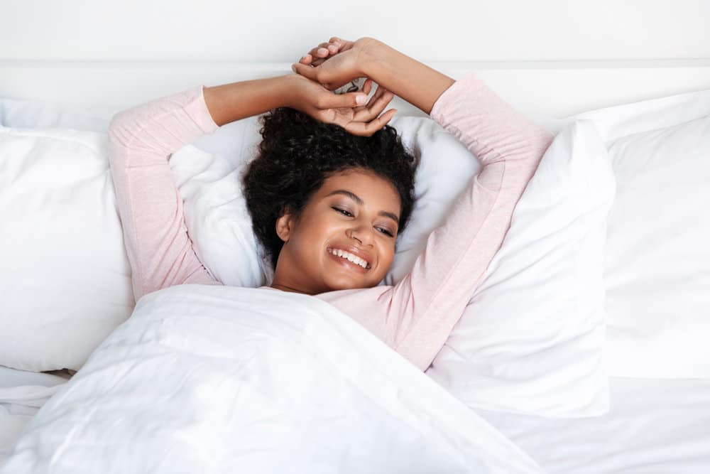 A cute young black female that wrap her hair upside-down sleeps on satin pillowcases frequently.