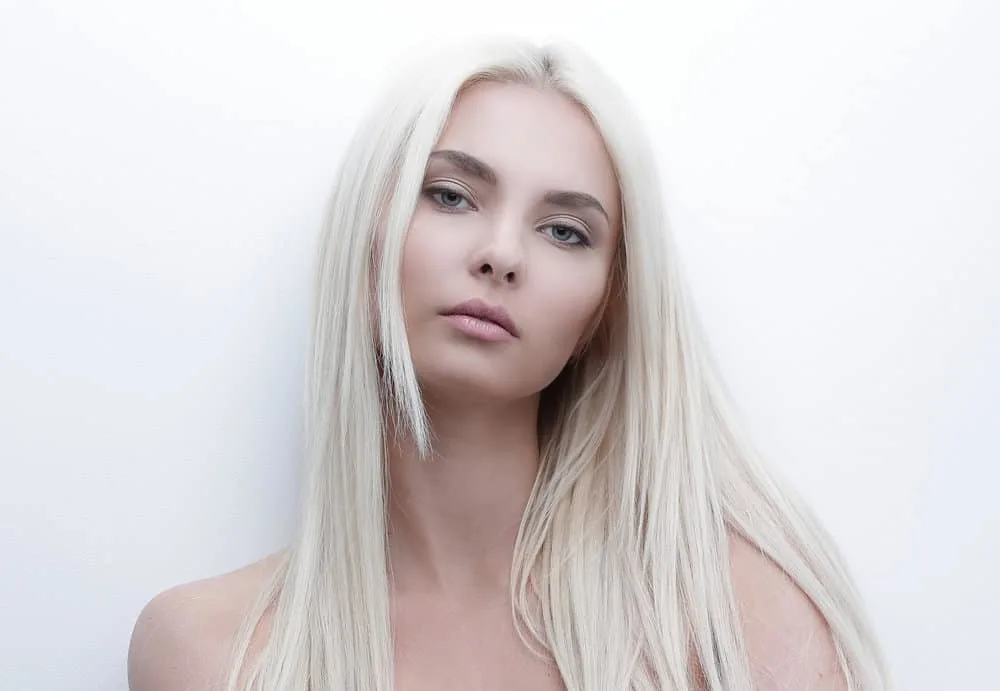 How to Get Platinum Blonde Hair from Golden Blonde at Home 2 A beautiful female with light platinum blonde bleached hair with purple pigments after leaving the hair salon.