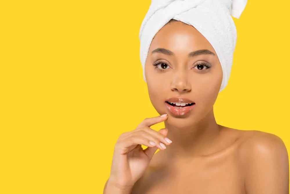 How to Plop Hair Overnight With a T-Shirt or Microfiber-Towel 8 Light-skinned African American woman with sopping wet hair on wavy hair after plopping her natural curls.