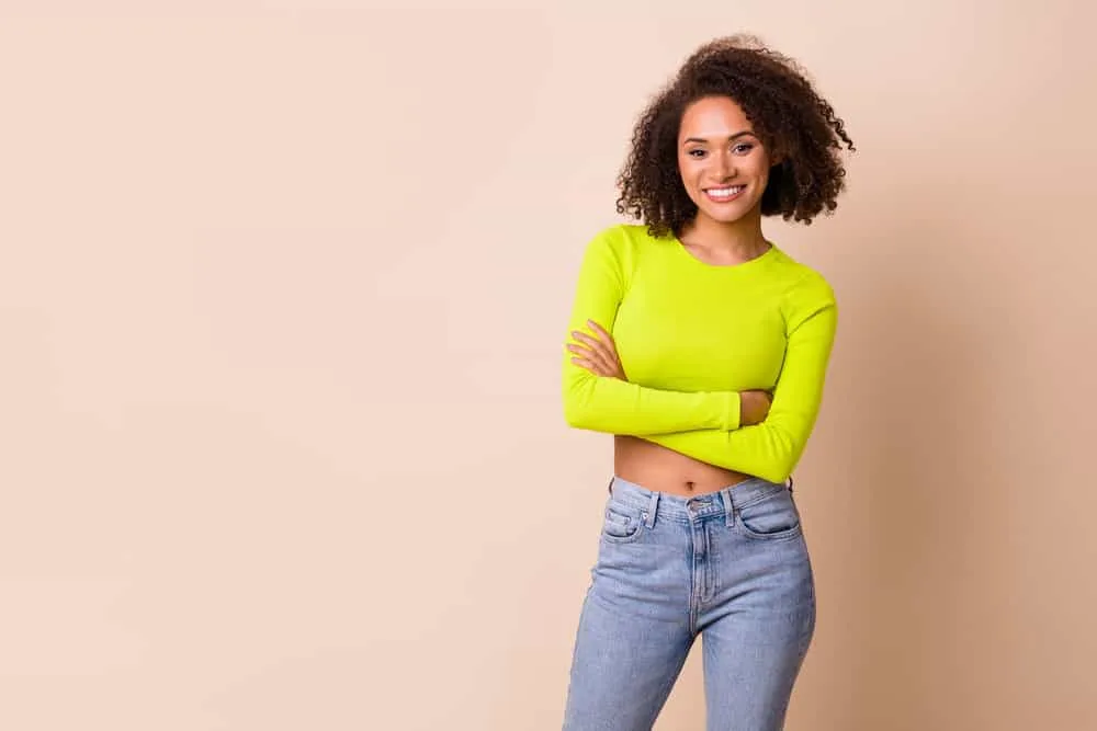 Is Love Beauty and Planet Good for Hair Care? Hair Growth? 8 A charming female that styles her curly hair with natural brands like LPL shampoo and lavender clarifying shampoo.