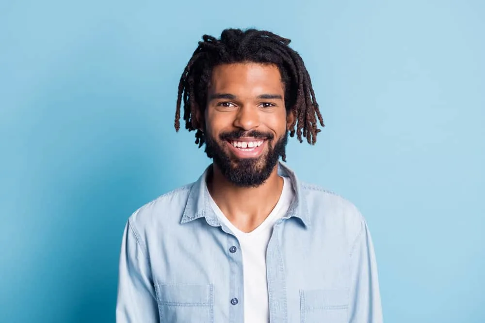 Lil Baby Hairstyle: How to Get Lil Baby Dreads Step-By-Step 3 Young black male with Lil Baby's undercut within the Justin Bieber circa '90 small and subtle styles worn messy.