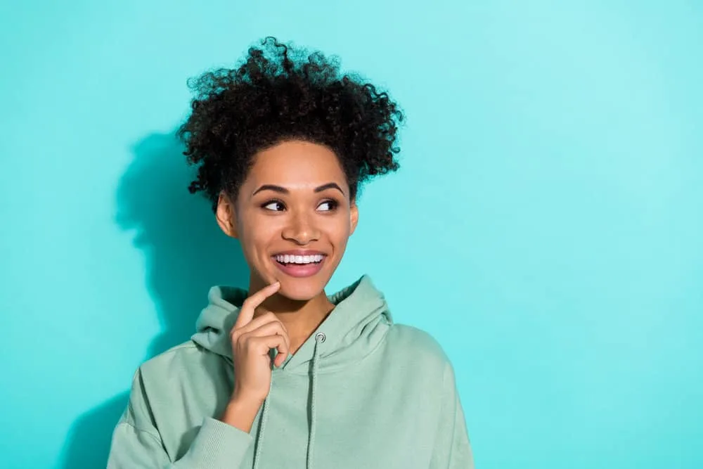 Does Sulfur8 Grow Hair? Help Dandruff? Does It Really Work? 7 A black lady hoping to scientifically heal hair with a proper hair care routine that includes moisturizing creams.