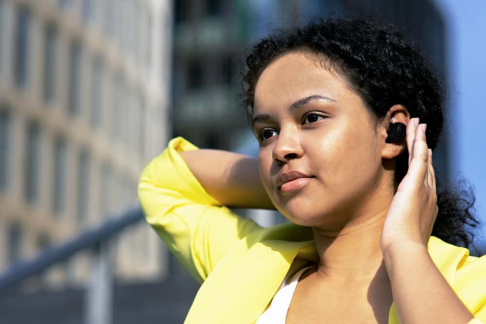 A young lady wearing a business suit after getting a professional salon treatment with sodium hydroxide.