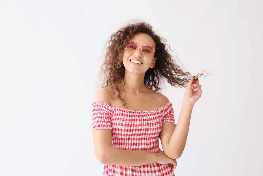 African-American female with a 3B natural hair type that's using the Curly Girl Method to create tight curls.