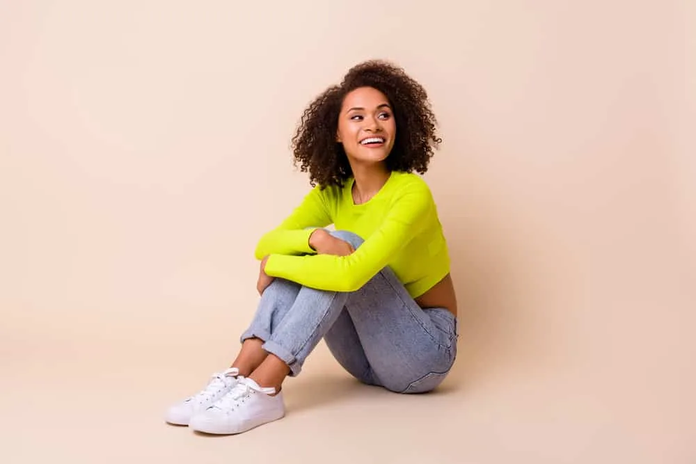 Is Love Beauty and Planet Good for Hair Care? Hair Growth? 16 Nice looking young woman with natural curls styled with a Unilever brand hair product called LBP shampoo.