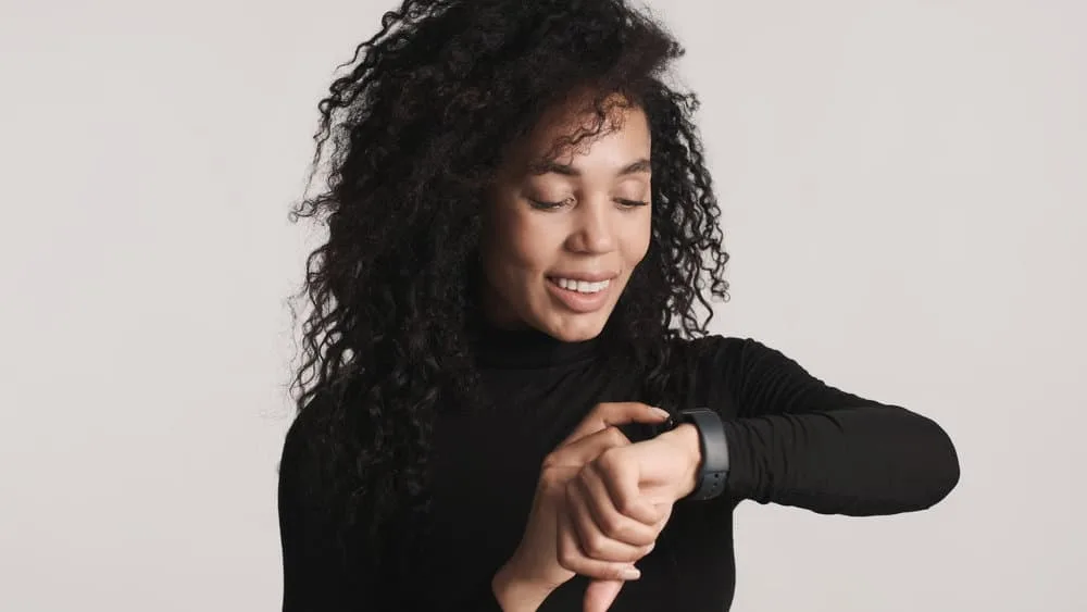 How to Thin Out Hair With and Without Thinning Shears 8 A young lady with medium hair thickness wearing a layered cut that keeps her hair healthy with anti-frizz products.
