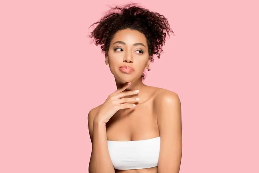 How to Plop Hair Overnight With a T-Shirt or Microfiber-Towel 3 A cute African American female with completely dry natural curls after using a hair dryer following a shower.