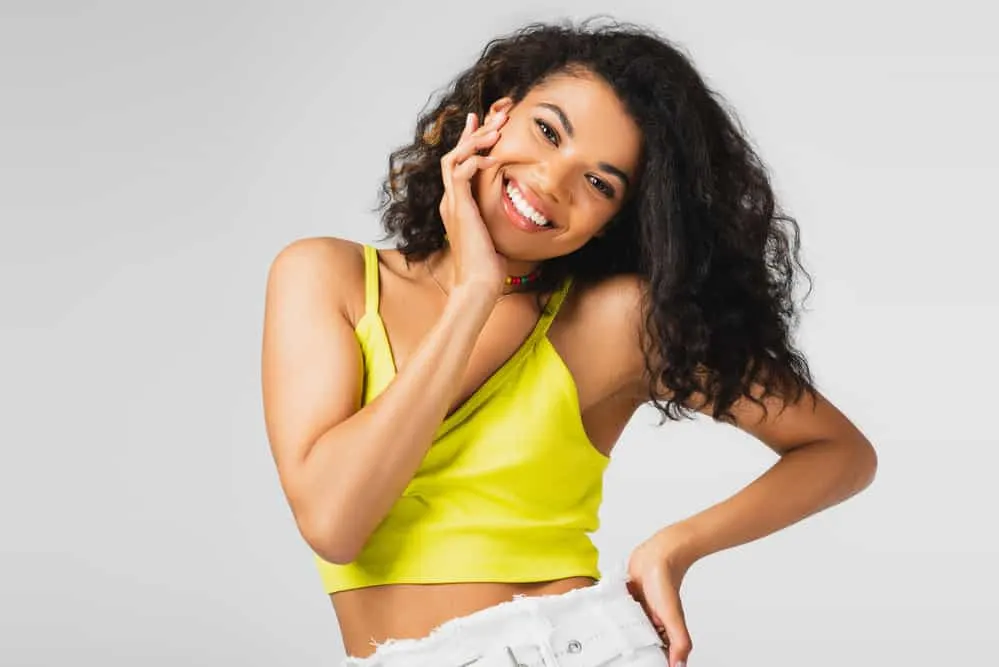 Does Not Washing Hair Cause Hair Loss, Thinning, & Breakage? 1 A cute black woman with greasy hair since frequent hair dye usage caused poor hair and scalp hair.