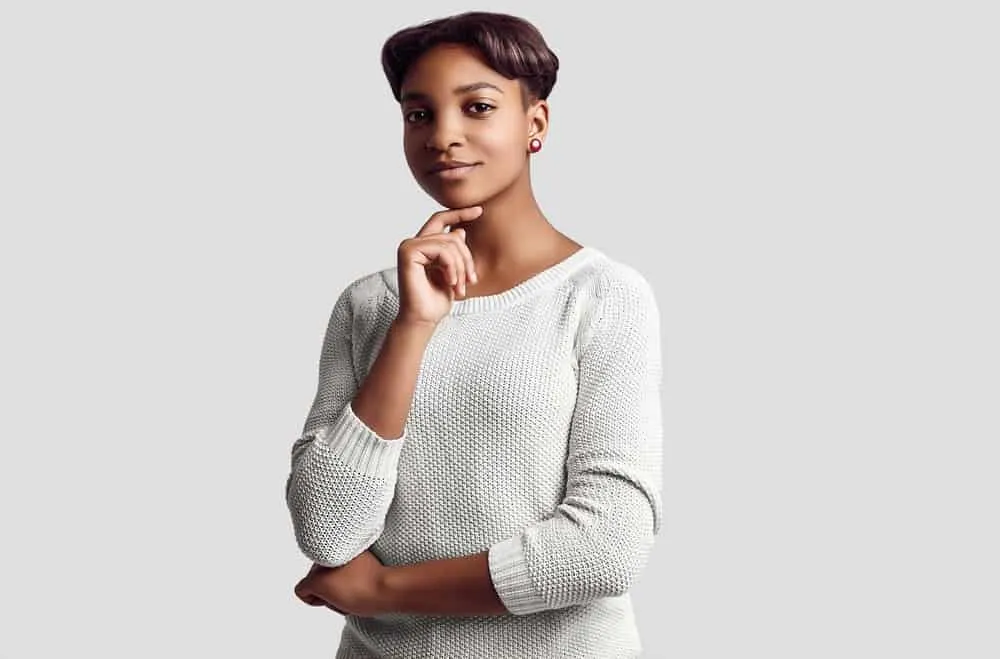 The Best Fun Unnatural Hair Colors for Warm Skin Tones 14 A lady dressed in a super cute casual outfit that has straightened hair with warm browns and deep black strands.