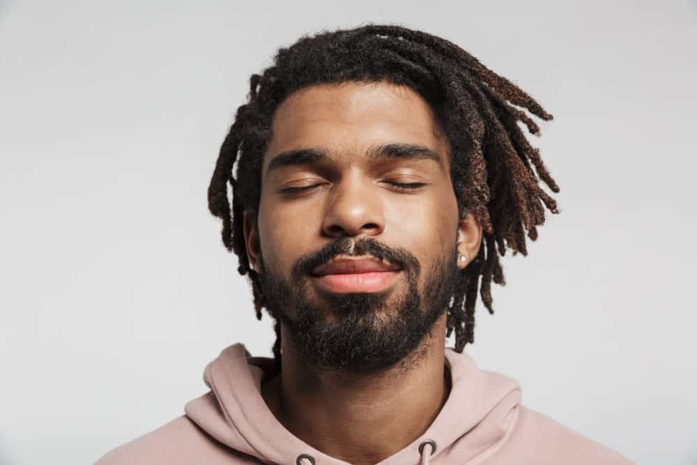 A 30-year-old male with faux dreadlocks created with human hair extensions wondering how to maintain starter locs.