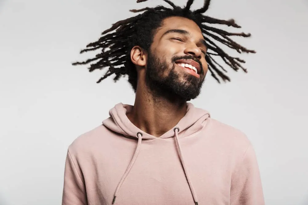 How Much Do Starter Locs Cost? Should You DIY Starter Locs? 6 African American dude with natural locs created using the freeform hair locking method on her 4B hair type.