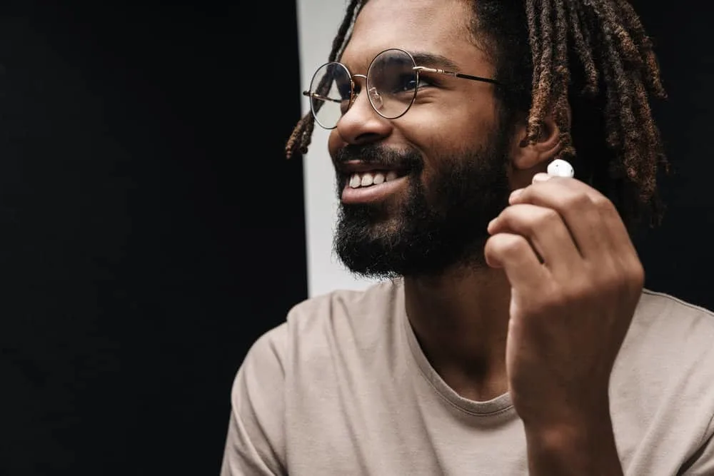 How to Moisturize Starter Locs and What to Use to Hydrate Locs 8 An African American man with naturally dry hair due to having 4B curly hair follicles has a low maintenance routine.