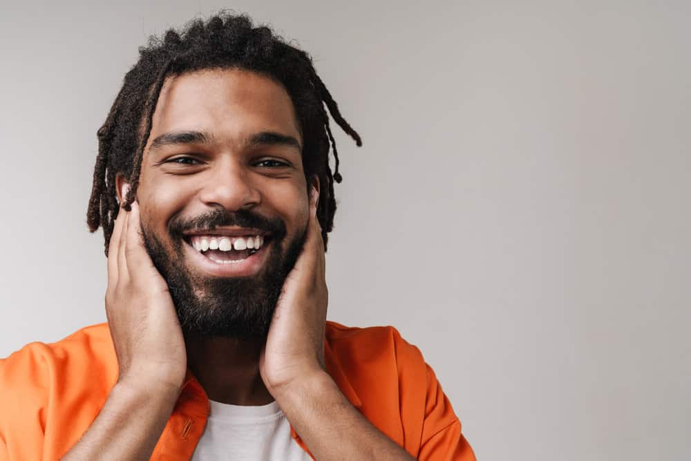 A male in the African American community wonders if soldiers wearing neatly trimmed locs are permitted in the physical fitness uniform.