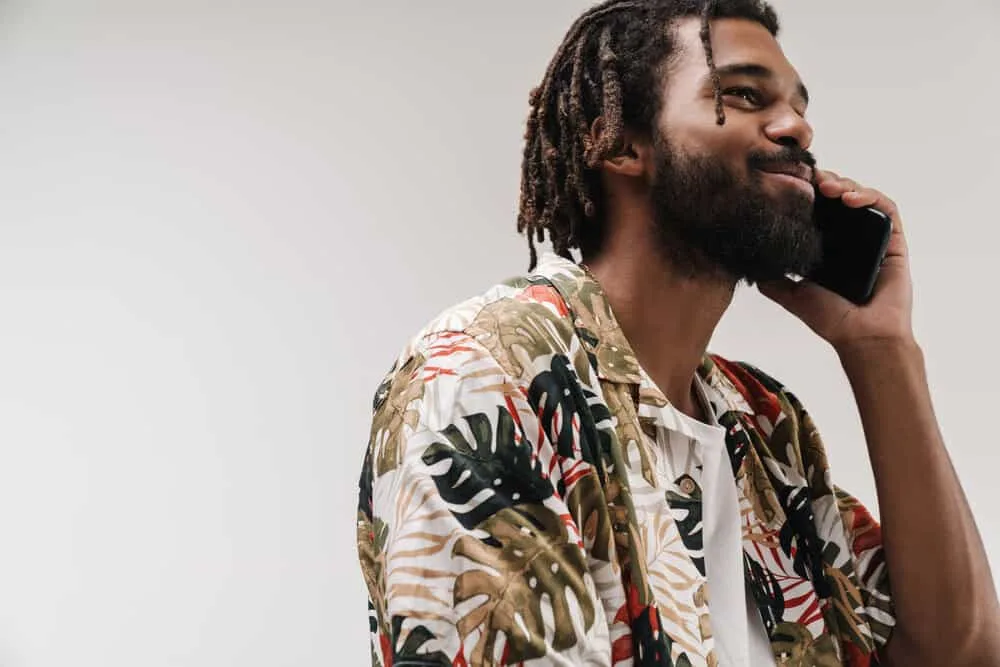 How to Make Locs Thicker Without Combining Them at the Root 5 An optimistic African man with thinner locs that were originally created from the two-strand twist method.