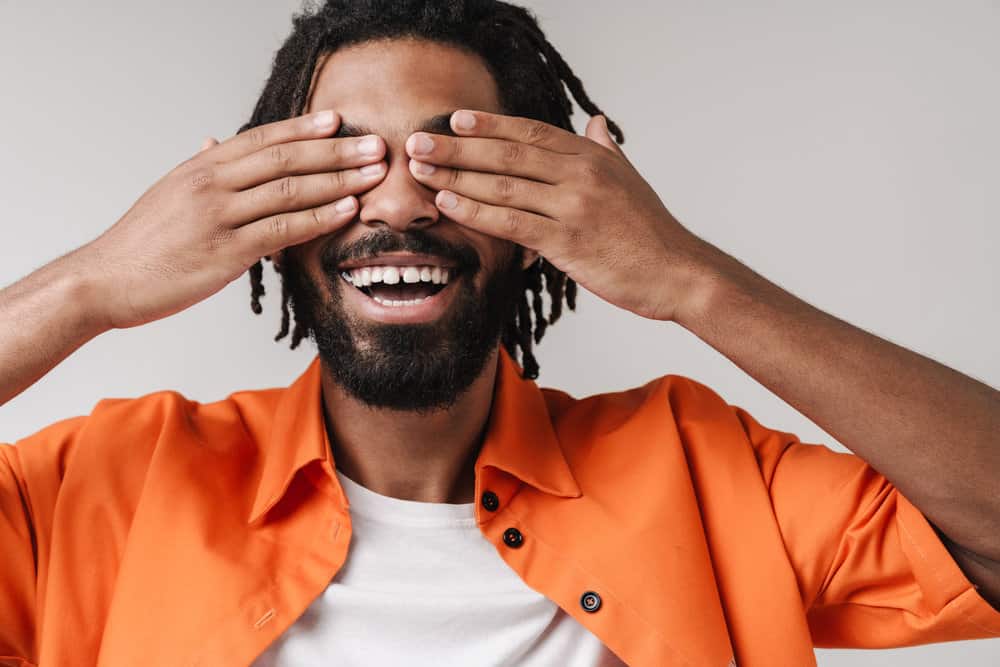 African American male with his nails trimmed (no nail polish) complying with the military grooming policy for men.