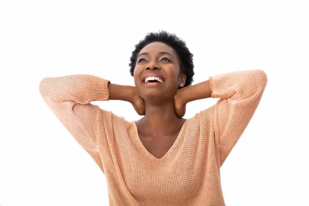 What Is 4C Hair? How To Take Care of It, Styles, and Products 2 A black female with two curl patterns on her 4B and 4C natural hair type conditioned with hot oil treatments.