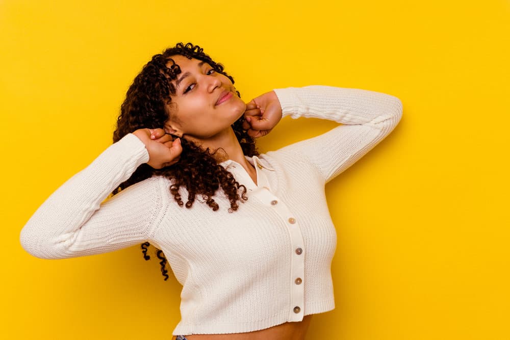 Light-skinned African-American female that used quick chemical treatments to convert her hair from its natural state.