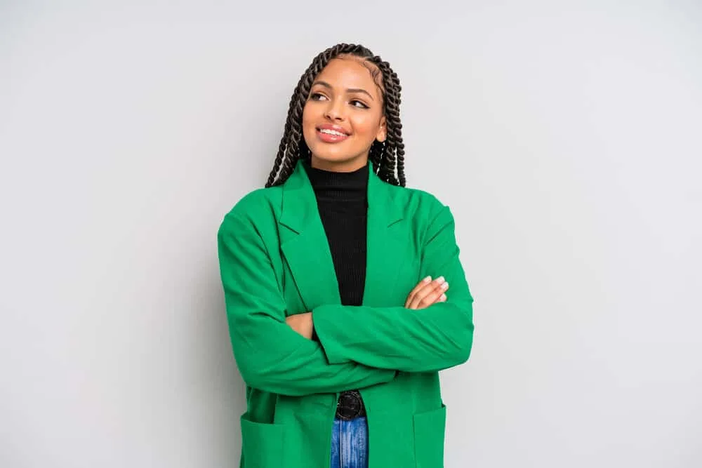 Does Twisting Your Hair Make It Grow Faster and Longer? 3 A black female wearing loose twists has edges styled with natural oils and alcohol-free moisturizing techniques.