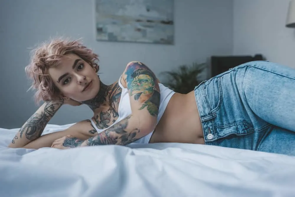 Does Hair Grow Over a Tattoo on Your Head, Body, Arms, or Legs? 1 A lady with inflamed skin after a head tattoo procedure caused temporary hair loss on the tattooed area.