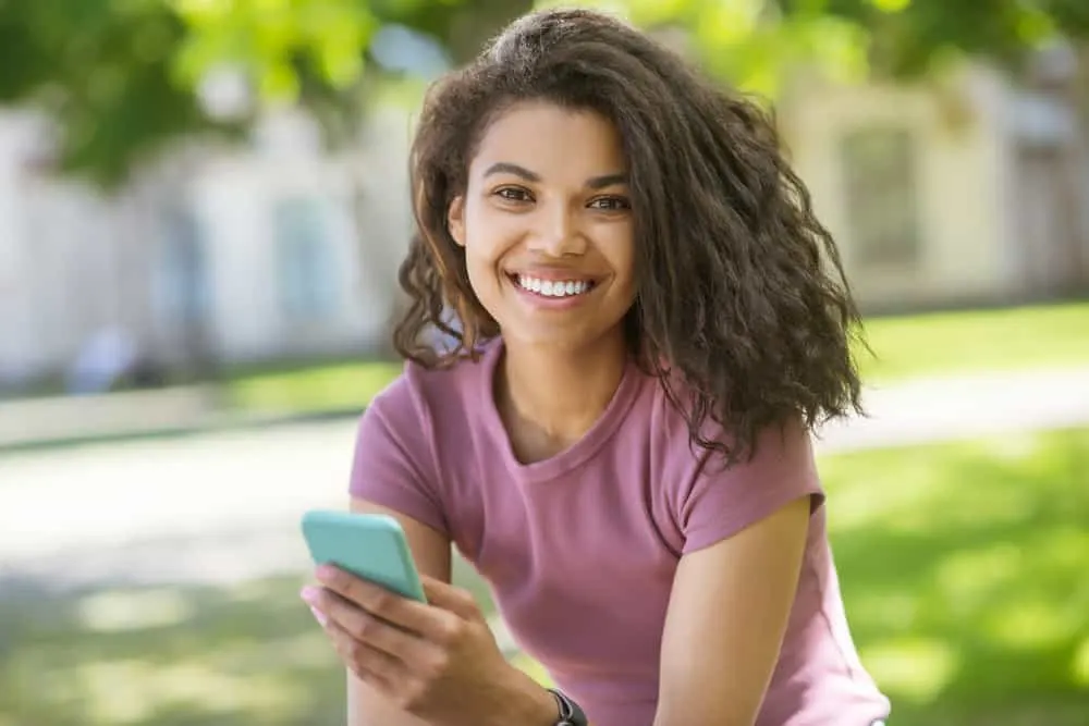 Flash Drying Hair: Is It Bad, Causes, How to Fix It, and More 1 A lady with high porosity hair reading about film-forming polymers and severe flash drying in a curly hair community.