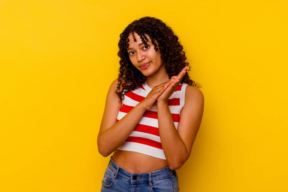 A mixed-race lady that used a Wave Nouveau neutralizer and chemical perm system in her naturally curly hair.