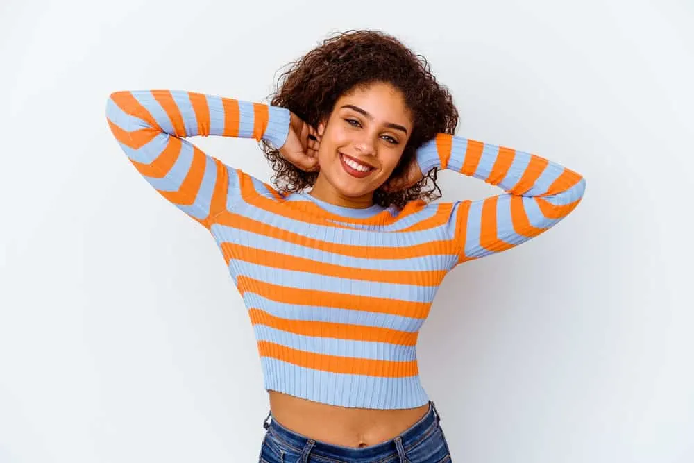 What Is a Hair Lightener? How Does Hair Lightener Work? 1 A young African American female with bleached hair strands from using hydrogen peroxide by a professional colorist.