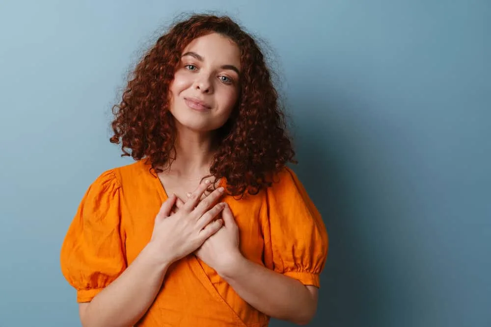 Get a Perm Out: How to Unperm Your Hair Naturally at Home 11 A Caucasian female with damaged hair immediately stopped using straightening shampoo.