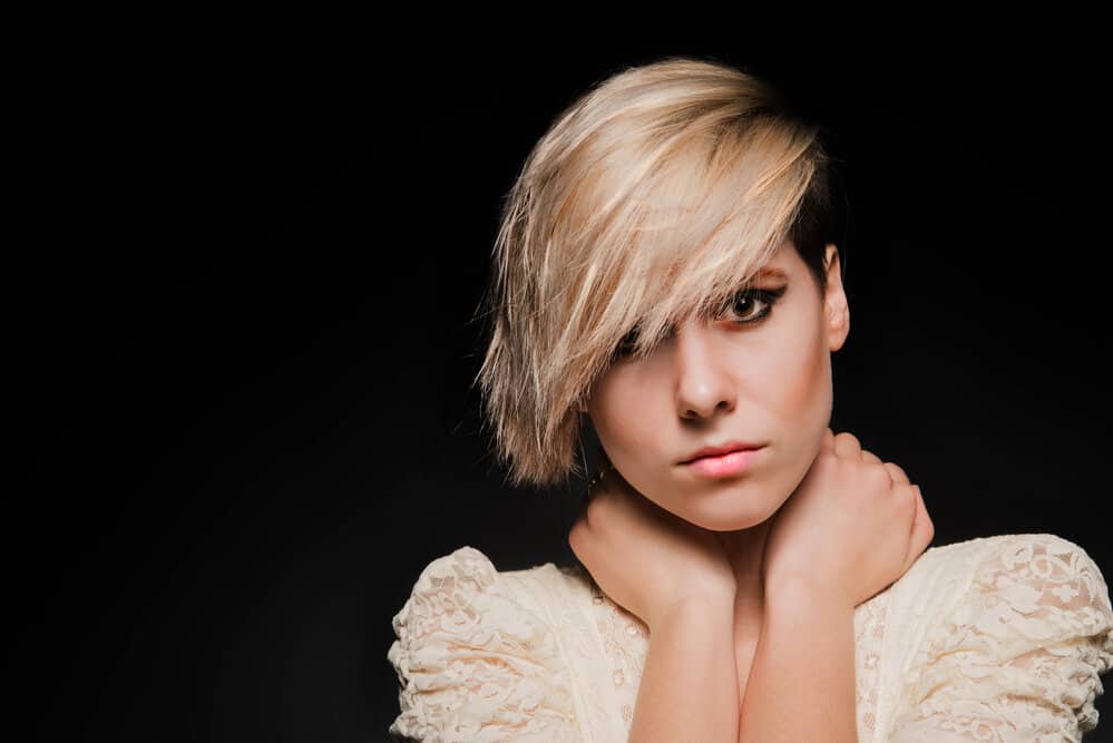 How To Avoid a Mullet When Growing Out A Pixie Cut Hairstyle 1 A lady with fine hair wearing a grown out Pixie short haircut that's at an awkward stage as she transitions to long hair.