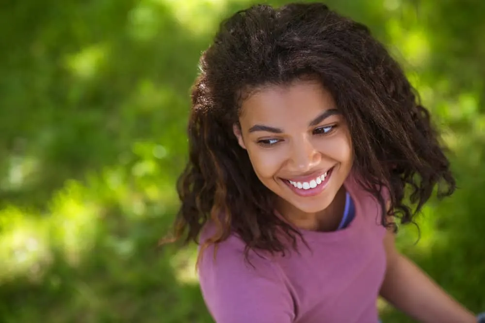 A woman with a great smile wonders why her hair won't absorb water molecules normally in extreme humidity conditions.