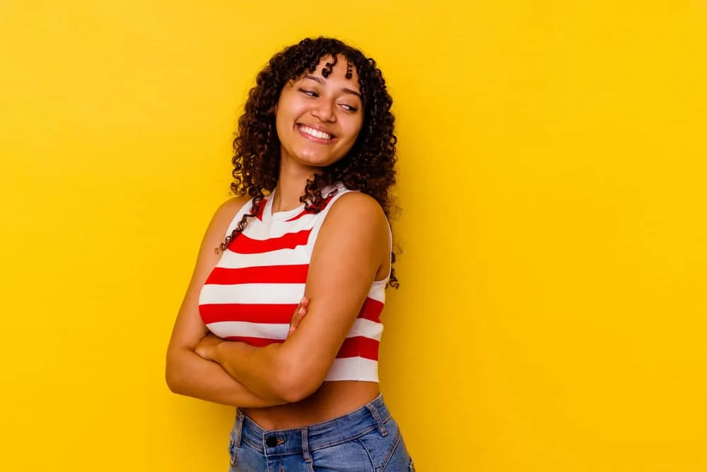 How to Stop Wave Nouveau Breakage: DIY Step-by-Step Guide 7 A light-skinned African lady that experienced hair breakage and brittle, dry hair after using a DIY Nouveau wave kit.