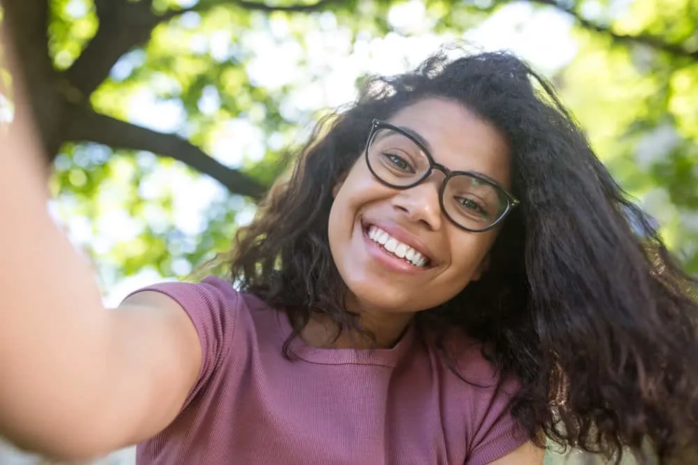 Flash Drying Hair: Is It Bad, Causes, How to Fix It, and More 9 A black girl with healthy hair styled with coconut oil and Prose - custom hair care formulations based on your needs.