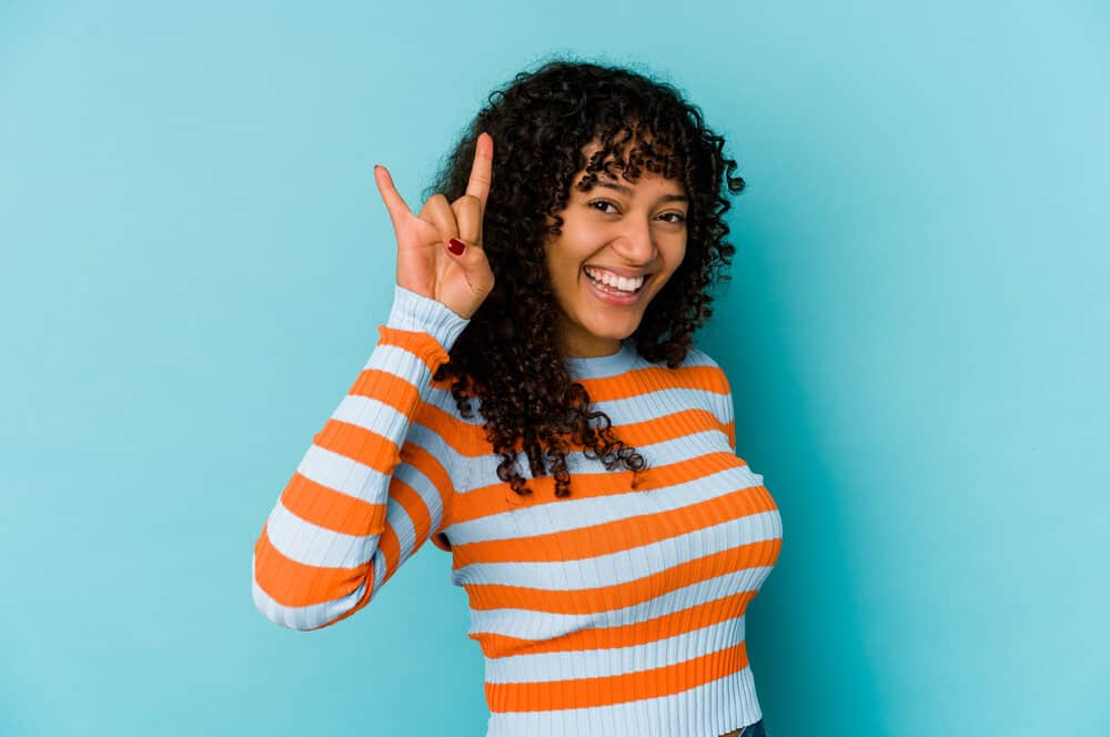 A happy Texas Longhorn fan that washes her hair regularly, but her hair has a wet dog smell and a flaky scalp.