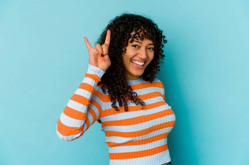 Why Does My Hair Smell Bad After I Wash It? Even Every Day? 8 A happy Texas Longhorn fan that washes her hair regularly, but her hair has a wet dog smell and a flaky scalp.