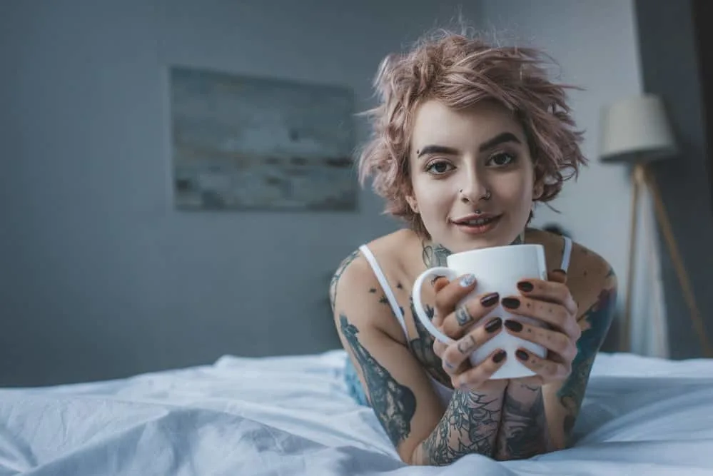 Does Hair Grow Over a Tattoo on Your Head, Body, Arms, or Legs? 4 A heavily tattooed female has an ingrown hair on the thin outer epidermal layer of her skin as the tattoo heals.