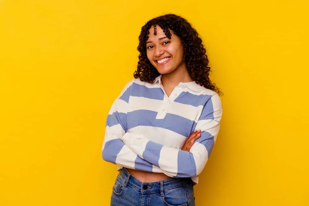 Does Your Scalp Itch When Your Hair Is Growing? Solutions? 8 A cute young mixed-race female with new growth after incorporating scalp massages into her hair growth regimen.