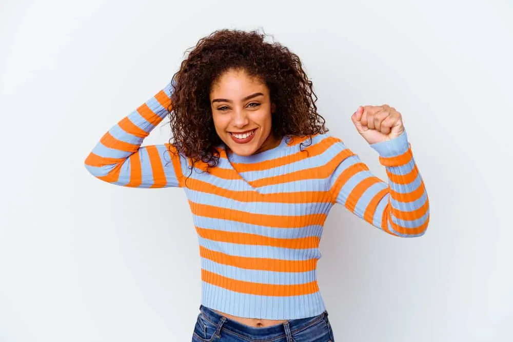 What Is a Hair Lightener? How Does Hair Lightener Work? 4 A happy female with light brown hair experienced hair cortex damaged from the chemical process.