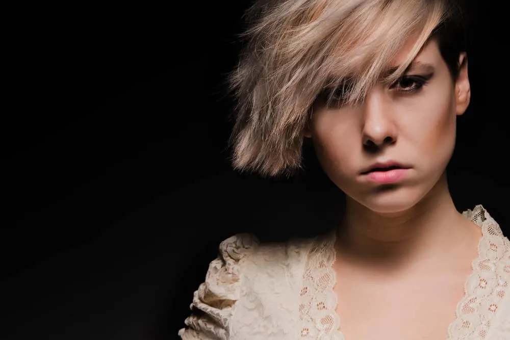 How To Avoid a Mullet When Growing Out A Pixie Cut Hairstyle 3 A cute female that worried about awkward lengths has she undergoes the growth process for her short pixie cut.